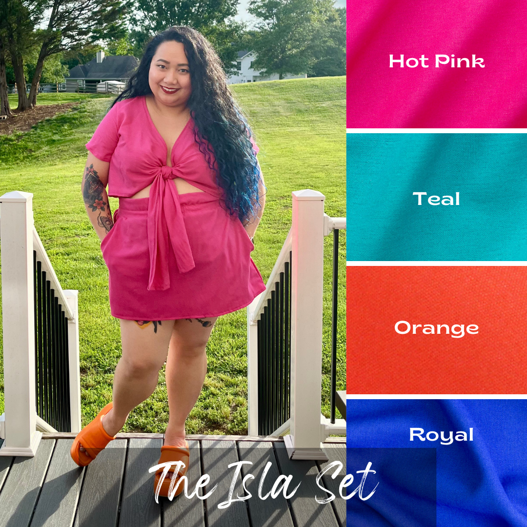 girl in backyard wearing short sleeved tie front crop top and skirt set. The Isla Set. Casstastrophe. Shop Casstastrophe. casstastropheshop.com. available in hot pink, teal, orange, and royal
