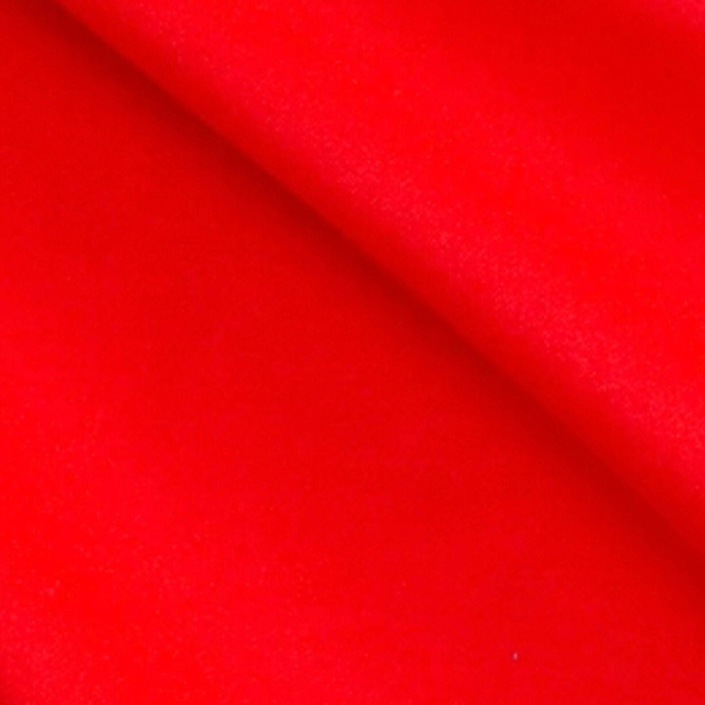 Close-up of red fabric with a smooth texture