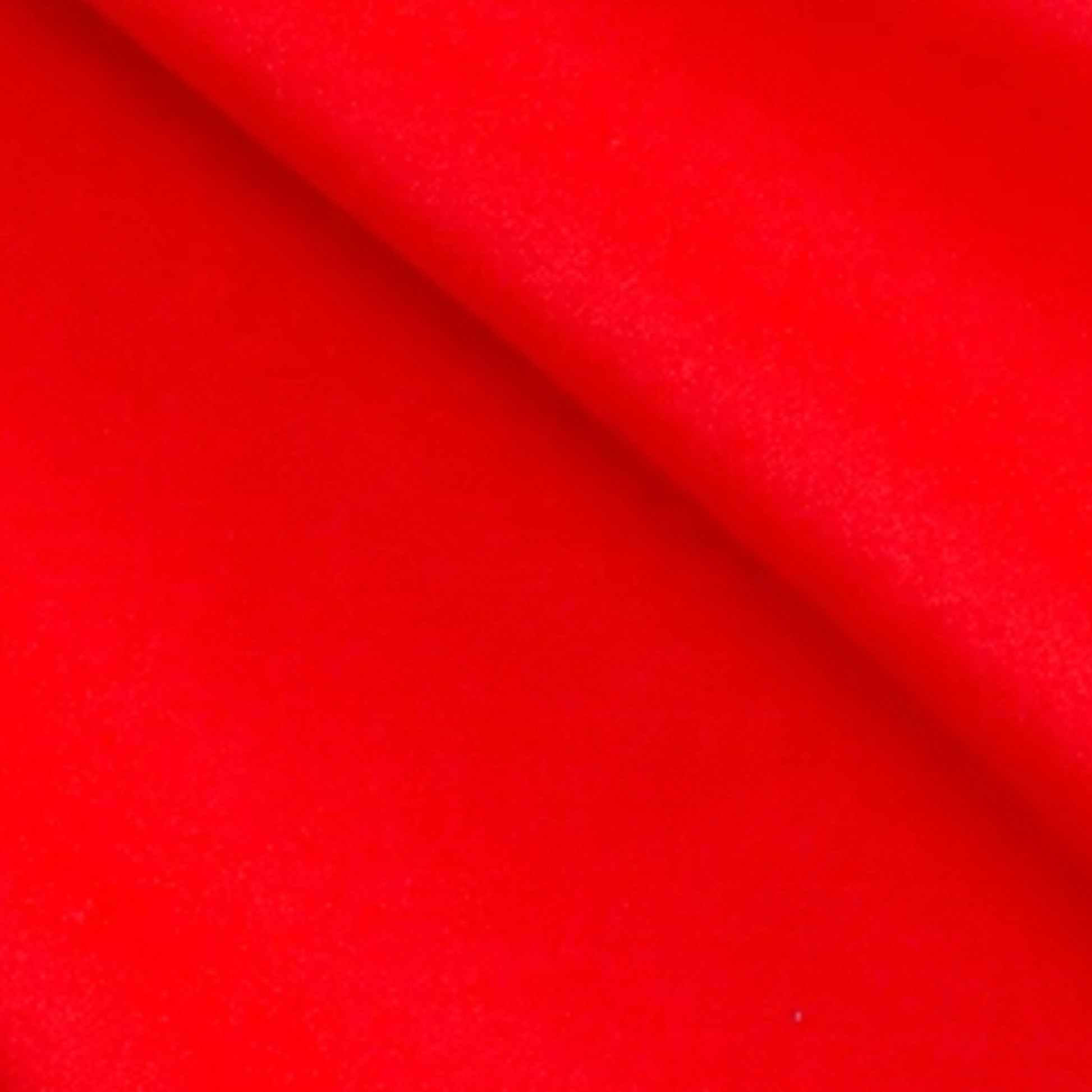 Close-up of red fabric with a smooth texture